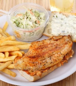 Carfish fillet sandwich with french fries and coleslaw