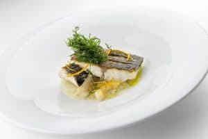 Slices of Sea Bass fillets on mashed vegetables